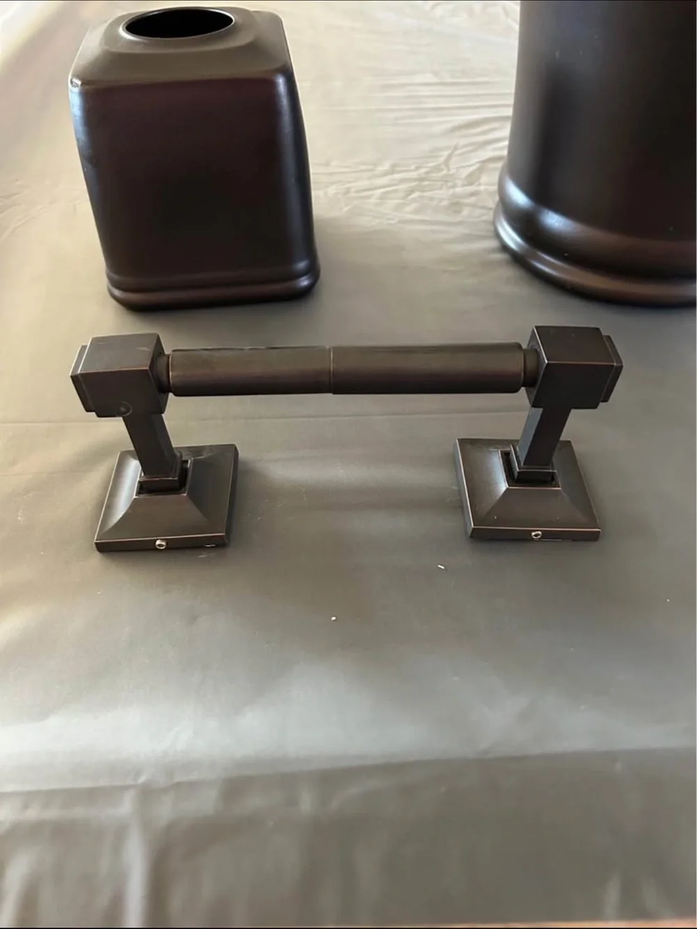 Restoration Hardware toilet paper holder with other accessories.